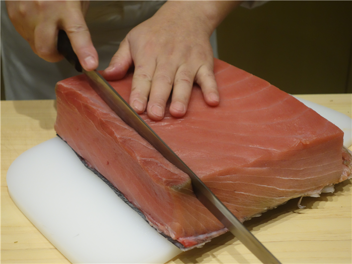 tuna being sliced